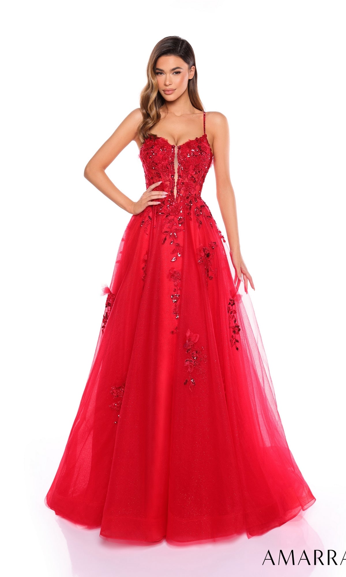 Woman wearing the Amarra 88086, a long formal red prom dress featuring thin straps, lace embroidery, floral embellishments, and a fitted bodice.
